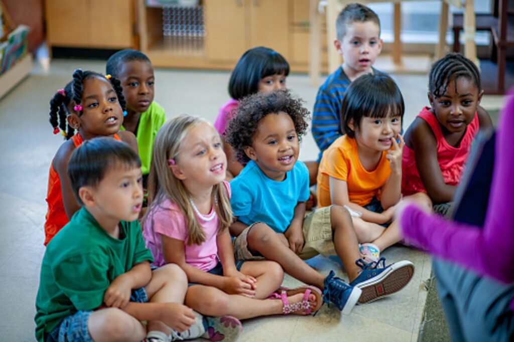 decorative, young students sitting on floor